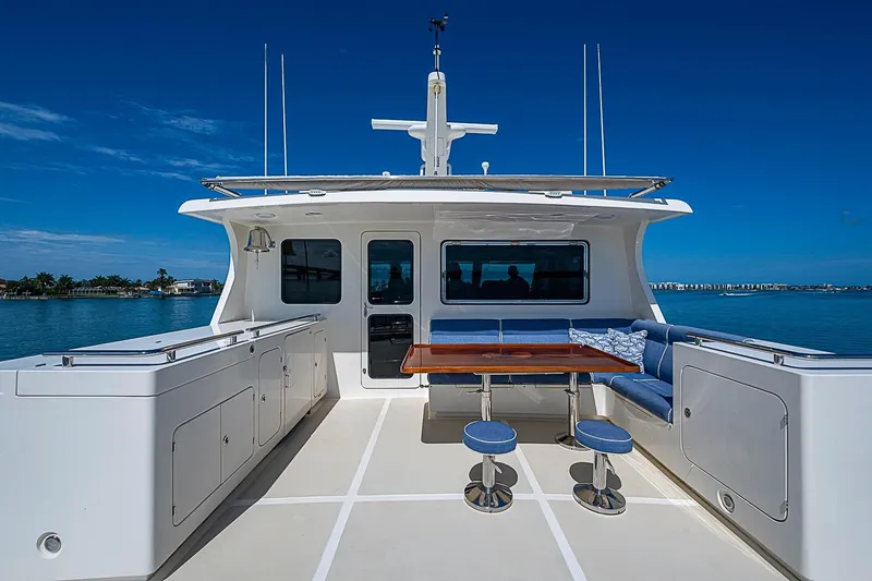 Slide: The Image of Luxurious 2014 Marlow 80 Explorer yacht deck with seating and ocean view. - 80