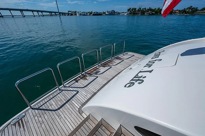 Slide: The Image of Luxury yacht Marlow 80 Explorer 2014 on serene water with bridge view. - 81