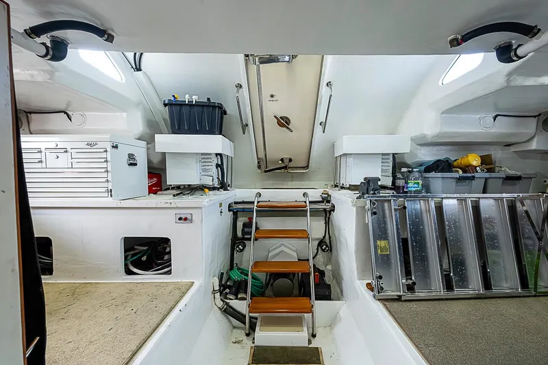 Slide: The Image of Engine room of 2014 Marlow 80 Explorer yacht with storage and equipment. - 85