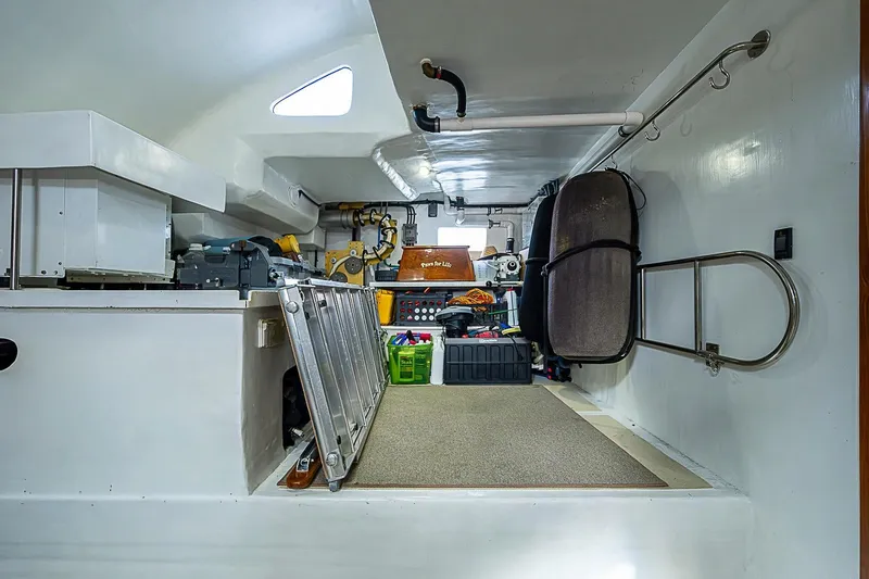 Slide: The Image of Interior of 2014 Marlow 80 Explorer yacht, featuring storage and equipment area. - 87