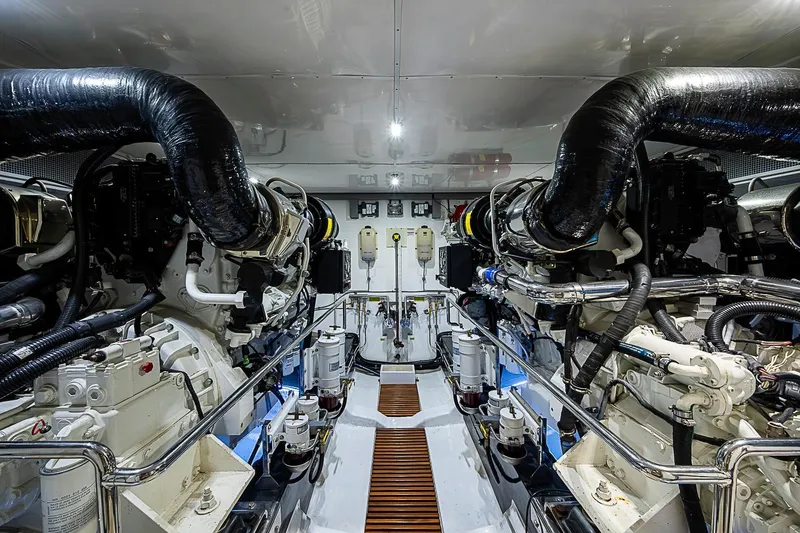Slide: The Image of Engine room of 2014 Marlow 80 Explorer yacht, showcasing dual engines and advanced machinery. - 88