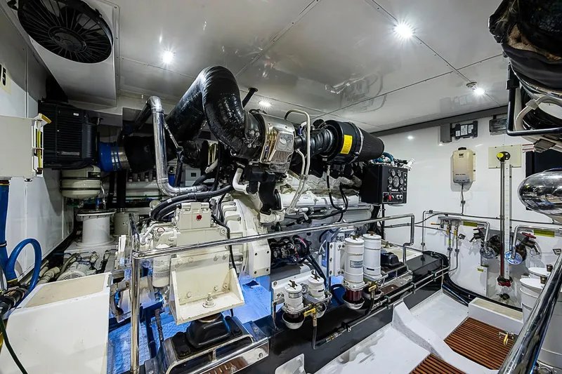Slide: The Image of Engine room of a 2014 Marlow 80 Explorer yacht, showcasing advanced machinery and equipment. - 89