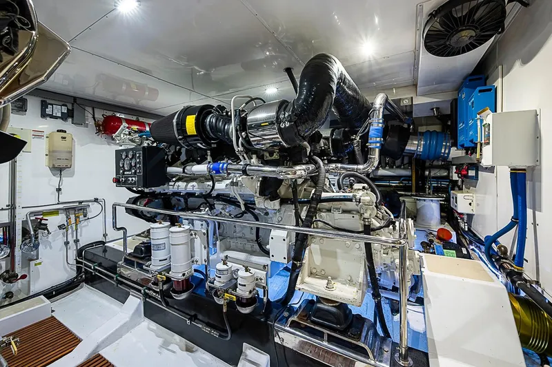 Slide: The Image of Engine room of 2014 Marlow 80 Explorer yacht, showcasing advanced machinery and equipment. - 90