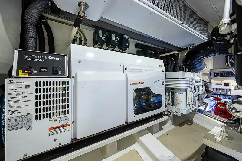 Slide: The Image of Engine room of 2014 Marlow 80 Explorer with Cummins Onan generator and Dometic equipment. - 92