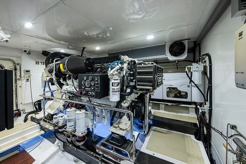 Slide: The Image of Engine room of 2014 Marlow 80 Explorer yacht, featuring advanced machinery and equipment. - 93