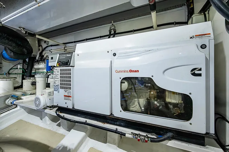 Slide: The Image of Engine room of 2014 Marlow 80 Explorer with Cummins Onan generator. - 94
