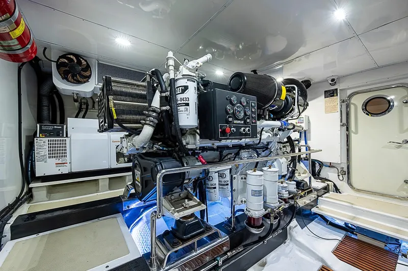 Slide: The Image of Engine room of 2014 Marlow 80 Explorer yacht, featuring advanced machinery and equipment. - 95