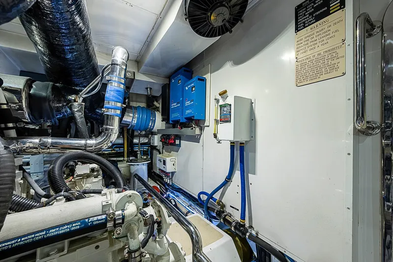 Slide: The Image of Engine room of 2014 Marlow 80 Explorer yacht, featuring mechanical and electrical components. - 97
