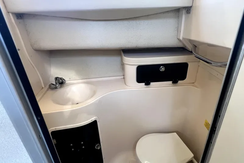 Slide: The Image of 2002 Grady-White Marlin 300 boat bathroom with sink and toilet. - 17