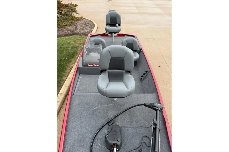 Slide: The Image of 2026 Tracker Bass Tracker Classic XL boat interior with gray seating and trolling motor. - 4