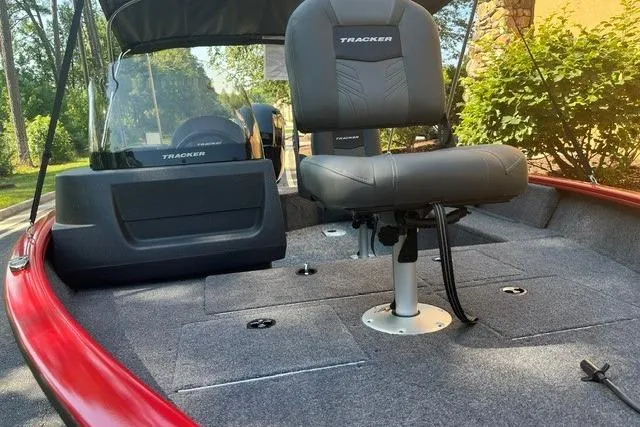 Slide: The Image of 2026 Tracker Pro Guide V-16 SC boat interior with seating and storage compartments. - 4