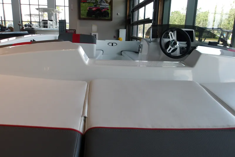 Slide: The Image of 2026 Tahoe T16 boat interior with steering wheel and cushioned seating. - 15