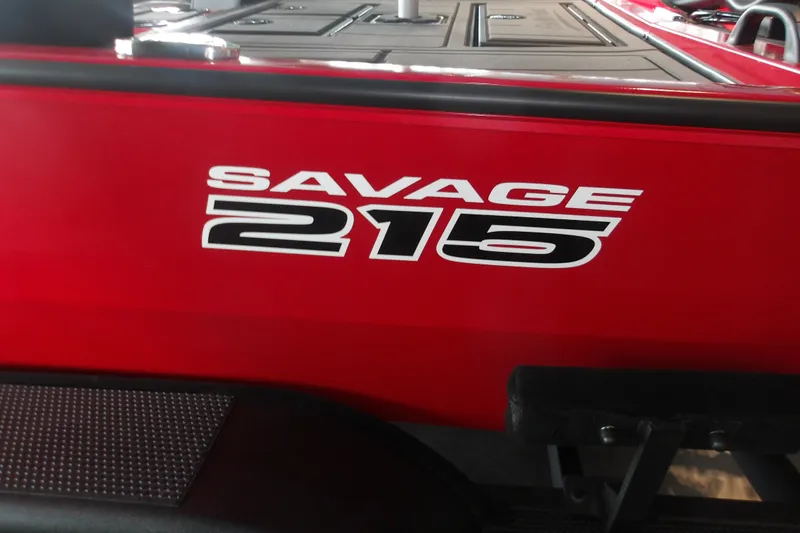Slide: The Image of Red Tracker Savage 215 boat, model year 2026, with bold white lettering. - 9