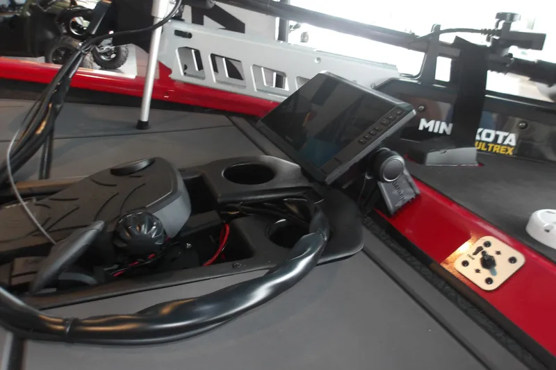 Slide: The Image of 2026 Tracker Savage 215 boat dashboard with electronic controls and Minn Kota Ultrex system. - 12