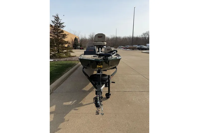 Slide: The Image of 2026 Tracker Bass Tracker Classic Limited boat on a trailer in a parking lot. - 4