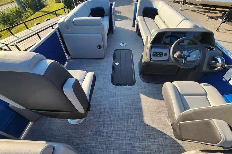 Slide: The Image of 2026 Sun Tracker Party Barge 22 XP3 interior with spacious seating and modern helm. - 5
