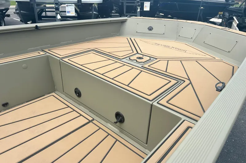 Slide: The Image of 2026 Tracker Grizzly 1650 T Prairie Wings Edition boat interior with tan and black deck design. - 3