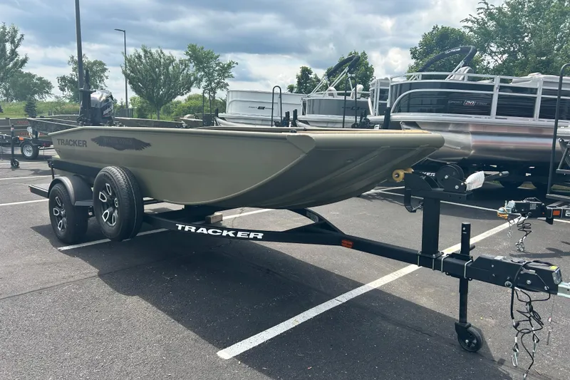 The Image of 2026 Tracker Grizzly 1650 T Prairie Wings Edition boat on trailer in parking lot. - 0