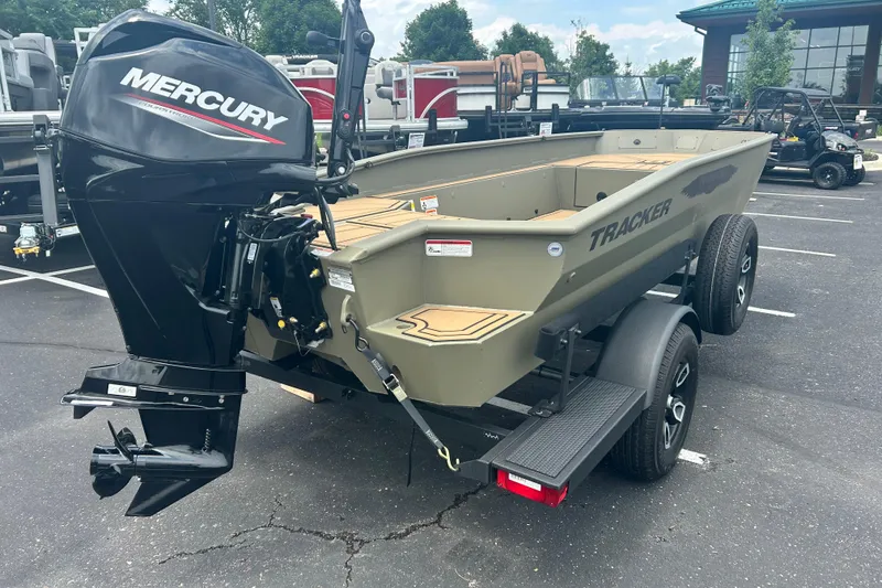 Slide: The Image of 2026 Tracker Grizzly 1650 T Prairie Wings Edition boat with Mercury engine on trailer. - 5