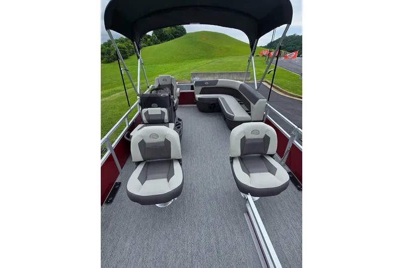 Slide: The Image of 2026 Sun Tracker Bass Buggy 16 XL Select pontoon boat interior with seating and canopy. - 9