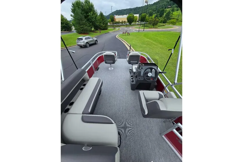 Slide: The Image of 2026 Sun Tracker Bass Buggy 16 XL Select pontoon boat interior with seating and steering console. - 8