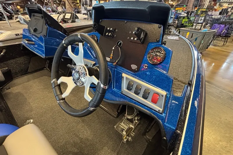 Slide: The Image of 2026 Nitro Z19 XL Pro boat dashboard with steering wheel and control panel. - 4