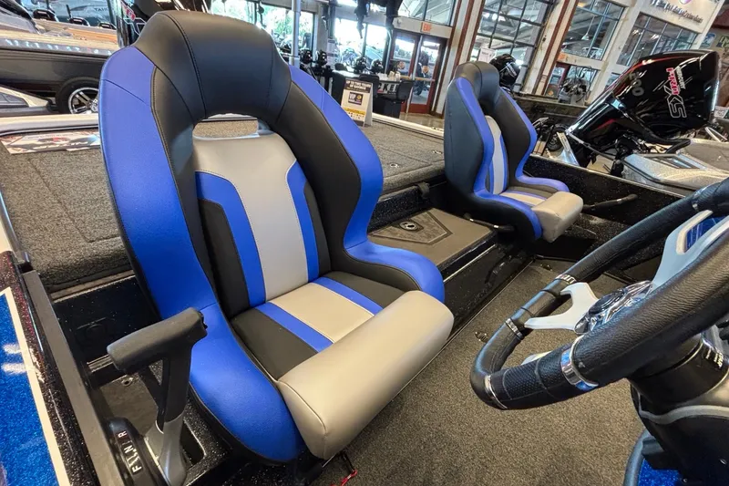 Slide: The Image of 2026 Nitro Z19 XL Pro boat interior with blue and gray seats, steering wheel visible. - 5