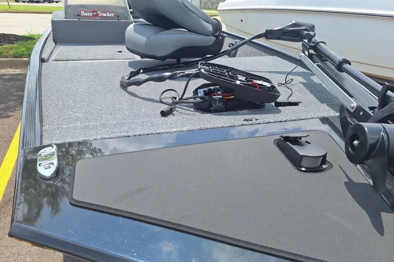 Slide: The Image of 2026 Tracker Bass Tracker Classic XL boat deck with seating and equipment. - 2