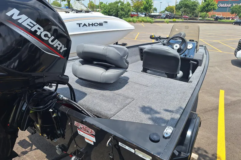 Slide: The Image of 2026 Tracker Bass Tracker Classic XL boat with Mercury engine in parking lot. - 3