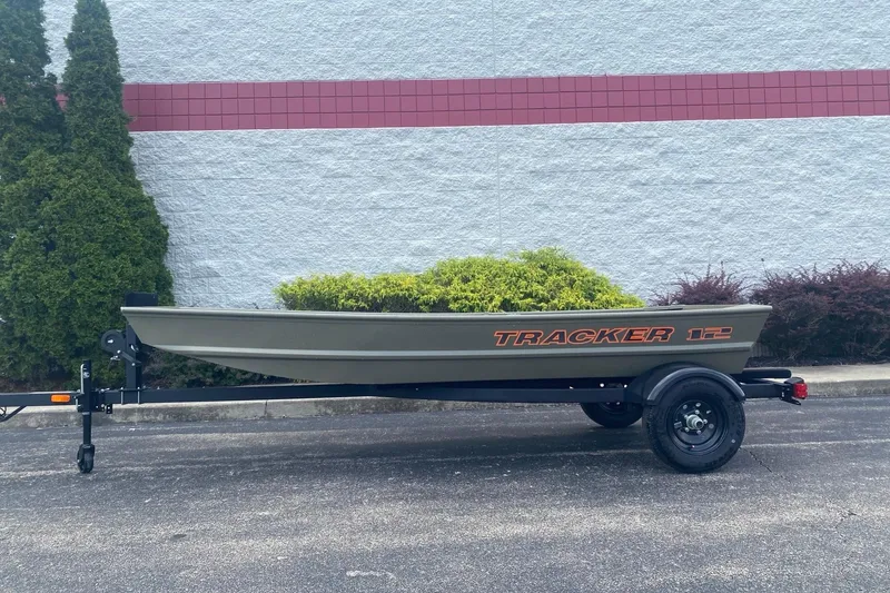 The Image of 2026 Tracker Grizzly 12 Jon boat on trailer, parked outdoors. - 0