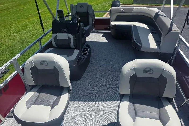 Slide: The Image of 2026 Sun Tracker Bass Buggy 16 XL Select pontoon boat interior with plush seating. - 3