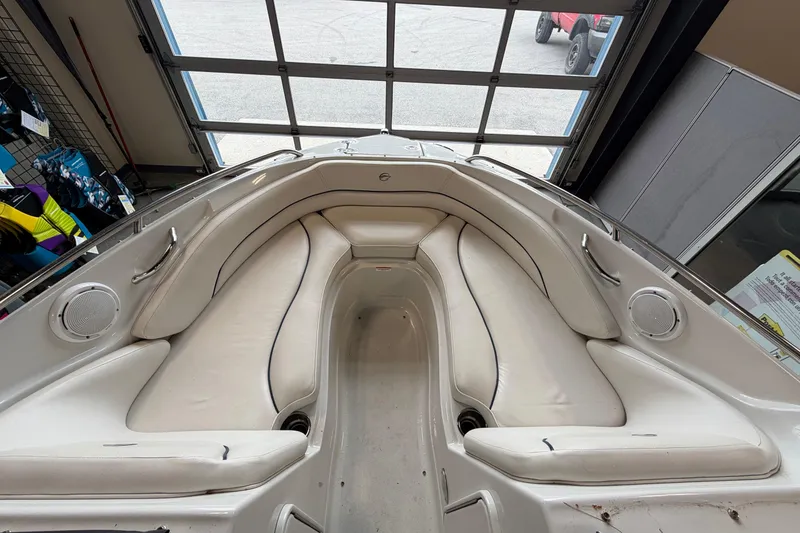 Slide: The Image of Interior view of a 2008 Crownline 220 LS boat with white seating and speakers. - 15