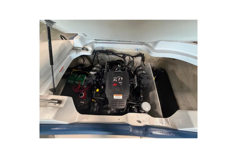 Slide: The Image of Engine compartment of a 2008 Crownline 220 LS boat, featuring a 5.0 MPI engine. - 16