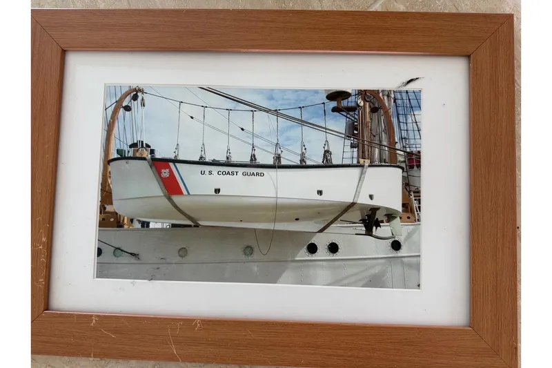 Slide: The Image of Framed photo of a U.S. Coast Guard boat by Ocean Technical Services, 1997. - 25