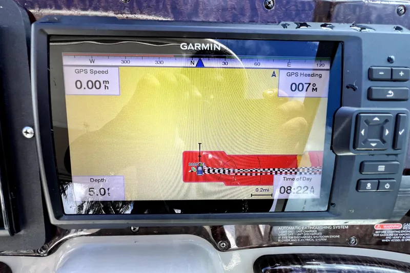 Slide: The Image of Garmin GPS display on 2007 Sea Ray Sundancer 310, showing speed, heading, and depth. - 23
