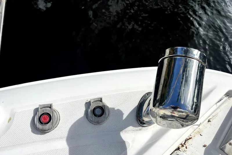 Slide: The Image of Control panel and chrome fixture on a 2007 Sea Ray Sundancer 310 boat. - 25
