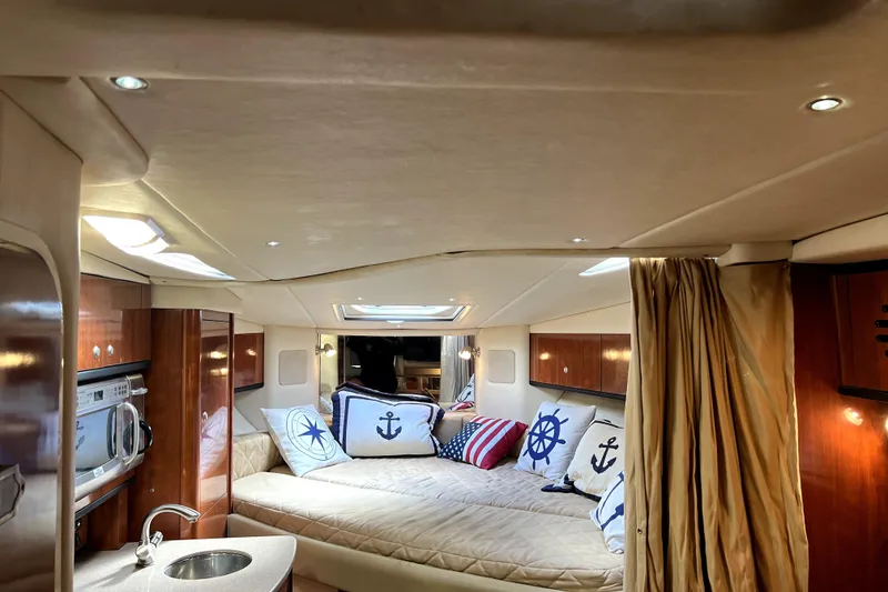 Slide: The Image of Luxurious interior of 2007 Sea Ray Sundancer 310 yacht with nautical-themed decor. - 27