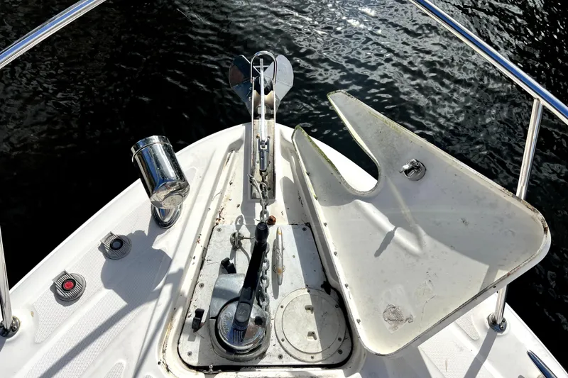 Slide: The Image of Bow of 2007 Sea Ray Sundancer 310 with anchor and railing over water. - 31