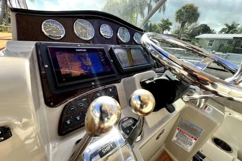 Slide: The Image of Dashboard of a 2007 Sea Ray Sundancer 310 with navigation system and controls. - 32