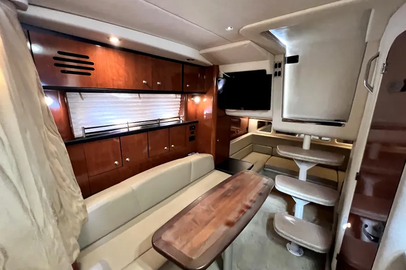 Slide: The Image of Luxurious interior of 2007 Sea Ray Sundancer 310 yacht with wood cabinetry and seating. - 36