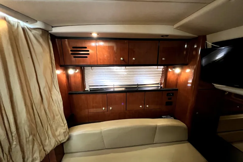 Slide: The Image of Luxurious interior of 2007 Sea Ray Sundancer 310 yacht with wood cabinetry and ambient lighting. - 40