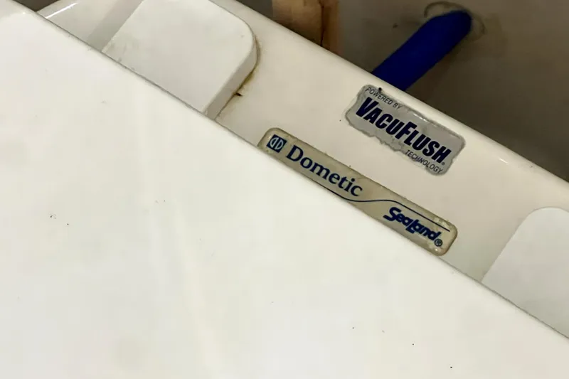 Slide: The Image of 2007 Sea Ray Sundancer 310 boat with VacuFlush and Dometic Sealand technology labels. - 44