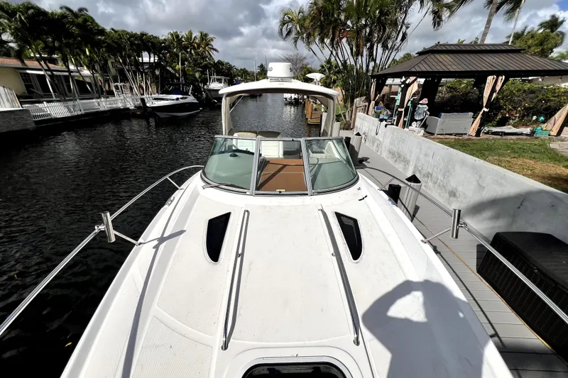 Slide: The Image of 2007 Sea Ray Sundancer 310 docked in a scenic canal setting. - 45
