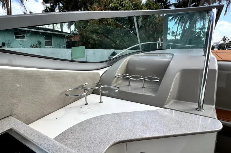 Slide: The Image of 2007 Sea Ray Sundancer 310 boat interior with cup holders and sleek design. - 46