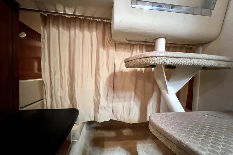 Slide: The Image of 2007 Sea Ray Sundancer 310 interior with beige curtains and seating area. - 57