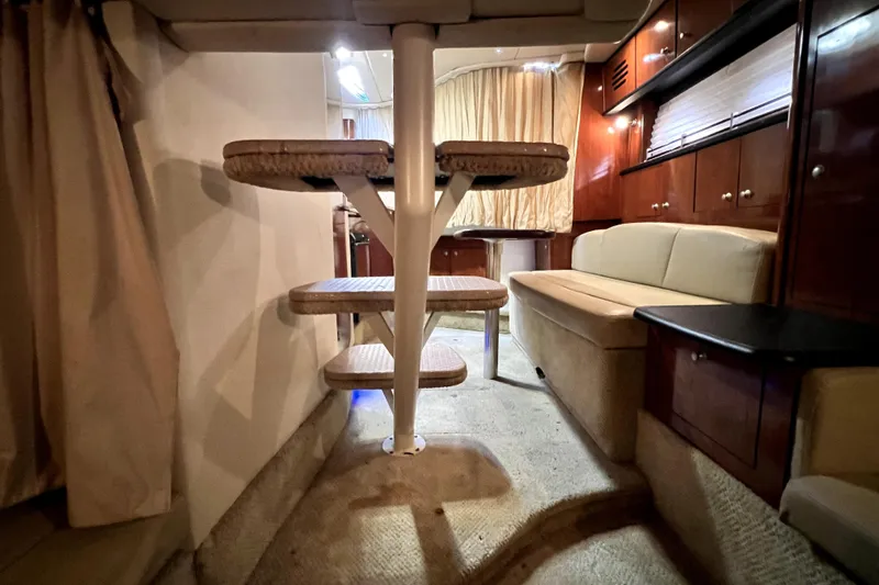 Slide: The Image of Interior of 2007 Sea Ray Sundancer 310 yacht with seating and wooden cabinetry. - 63