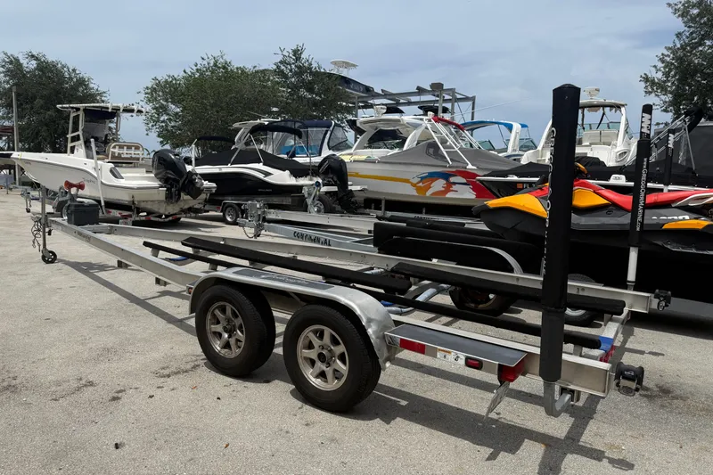 Slide: The Image of 2017 Yellowfin 24 Bay CE boat on trailer, surrounded by various boats in a marina. - 102