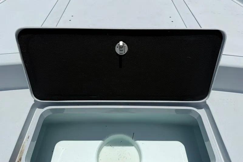 Slide: The Image of Open storage compartment on a 2017 Yellowfin 24 Bay CE boat. - 12