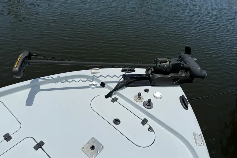 Slide: The Image of 2017 Yellowfin 24 Bay CE boat with trolling motor on calm water. - 18