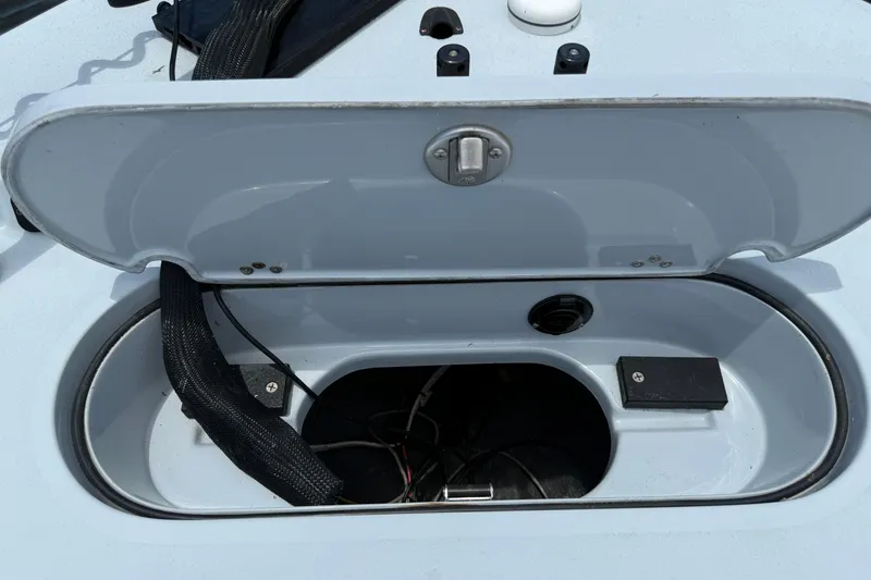 Slide: The Image of Open hatch on 2017 Yellowfin 24 Bay CE boat, showing internal compartment. - 19